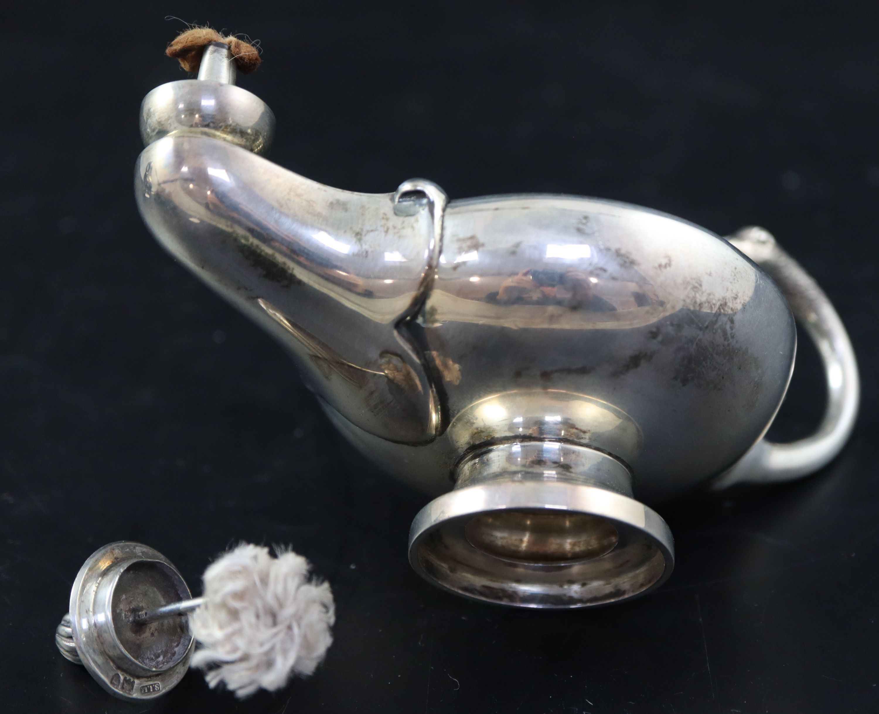 A George V silver Aladdins Lamp club lighter, length 13cm, gross 138 grams.